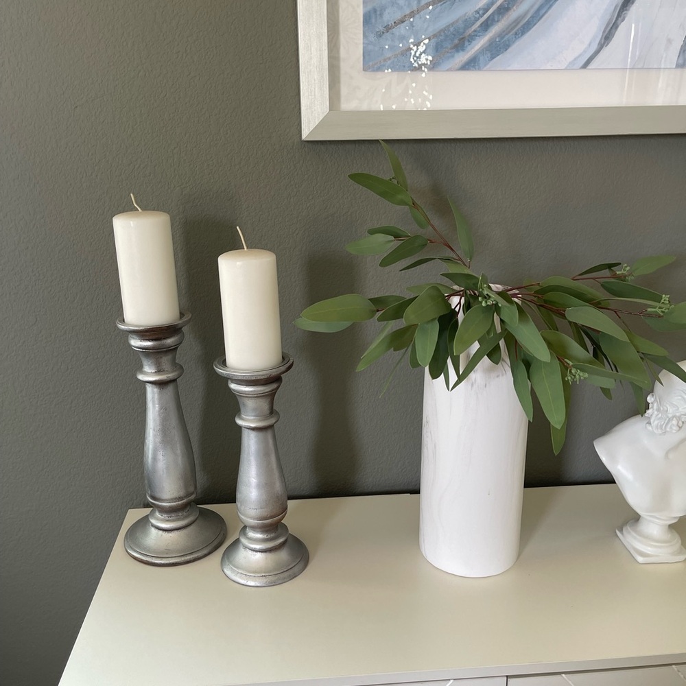 Two silver candle holders.